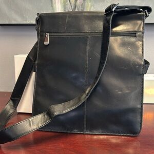 Wilson’s Leather black leather satchel with multiple pockets and compartments